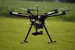 A hexacopter drone is flown during a drone demonstration at a farm and winery on potential use for board members of the National Corn Growers, Thursday, June 11, 2015 in Cordova, Md. Routine commercial use of small drones got a green light from the Obama administration June 21, 2016, after years of struggling to write regulations that would both protect public safety and unleash the economic potential and societal benefits of the new technology.