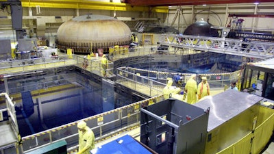 In this May 16, 2006 file photo, employees and contractors work inside Quad Cities Generating Station at the Exelon Nuclear plant in Cordova, Ill. Exelon Corp. says it will shut two Illinois nuclear plants after the Illinois Legislature declined to act on its request for financial support. The Chicago-based power provider said Thursday June 2, 2016 that it will close the Clinton Power Station in Clinton on June 1, 2017, and the Quad Cities Generating Station in Cordova on June 1, 2018.
