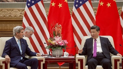 Chinese President Xi Jingping, right, talks to U.S. Secretary of State John Kerry, left, during a meeting at the Great Hall of the People in Beijing Tuesday, June 7, 2016.