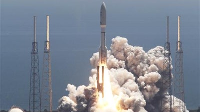 In this Friday, Aug. 5, 2011 file photo, an Atlas V rocket carrying the Juno spacecraft lifts off from Space Launch Complex-41 in Cape Canaveral, Fla. It was the first step in Juno's 1.7 billion-mile voyage to the gas giant planet, Jupiter.