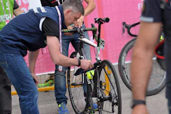 In this May 18, 2016 photo, a bicycle is inspected after arriving in Asolo, Italy after the 11th stage of the Giro d'Italia cycling race. There is perhaps no Olympic sport as dependent on technology as cycling, where space-age, feather-light carbon fiber bikes can cost more than a car _ and make the difference between a gold medal and nothing. That has also made the sport ripe for a new kind of doping: mechanical doping.