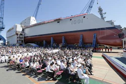 A crowd watches the christening ceremony for the Zumwalt-class guided missile destroyer Michael Monsoor (DDG 1001) Saturday, June 18, 2016 at Bath Iron Works in Bath, Maine.