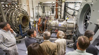 People tour the testing facilities during an open house at the Notre Dame Turbomachinery Laboratory, Tuesday, June 7, 2016, in South Bend, Ind.