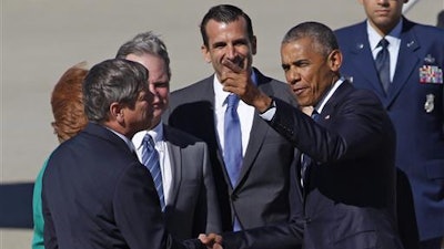 President Barack Obama chats with guests after arriving on Air Force One at Moffett Federal Airfield, on Thursday, June 23, 2016, in Mountain View, Calif. President Obama will speak at the 7th annual Global Entrepreneurship Summit tomorrow, Friday, June 24, 2016.