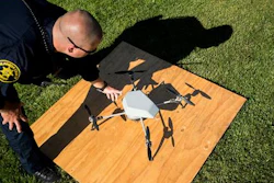In an Aug. 14, 2015 file photo, Alameda County Sheriff's Deputy Dave Durbin prepares to fly a drone during a demonstration of a search and rescue operation, in Dublin, Calif.