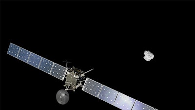Artist impression of ESA's Rosetta approaching the comet 67P/Churyumov-Gerasimenko. The comet image was taken on August 2, 2014 by the spacecraft's navigation camera at a distance of about 500 km. The spacecraft and comet are not to scale.