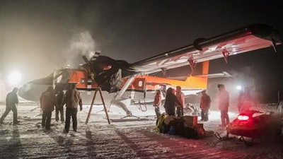In this photo provided by the National Science Foundation, a small plane picks up a sick worker at the U.S. South Pole science station. Once the sick patient and the crew rest, they will then fly off Antarctica for medical attention that could not be provided on the remote continent.