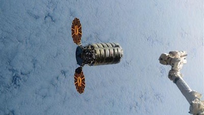 In this Dec. 9, 2016, file photo made available by NASA via Twitter, a Cygnus spacecraft approaches the International Space Station. A similar Cygnus spacecraft is set to burn up over the Earth's atmosphere on Wednesday, June 22, 2016.