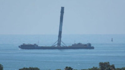 This June 2, 2016 photo made available by SpaceX shows the company's returned first-stage booster rocket on its ocean-landing platform, off the coast of Florida. The Falcon 9's legs were damaged during landing.