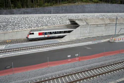 In this Oct. 8, 2015 file photo a test train drives close to the northern gate near Erstfeld, Switzerland. The celebrations of the opening of the Gotthard Base Tunnel will start on June 1, 2016. With a length of 57 km (35 miles) crossing the Alps, the Gotthard Base tunnel is the world's longest train tunnel.
