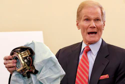 In this Nov. 20, 2014, file photo, Senate Commerce Committee member Sen. Bill Nelson, D-Fla., holds an example of a defective air bag made by Takata of Japan that has been linked to multiple deaths and injuries in cars driven in the U.S., during a hearing on Capitol Hill in Washington.
