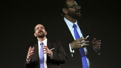 In this Nov. 6, 2015 file photo, Toyota Motor Corp.'s Executive Technical Advisor Gill Pratt delivers a speech during a press conference on artificial intelligence in Tokyo. The U.S. robotics expert tapped to head Toyota's Silicon Valley research company says the $1 billion investment by the giant Japanese automaker will start showing results within five years.