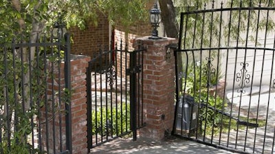 The driveway to the home of Anton Yelchin, a rising actor, best known for playing Chekov in the new 'Star Trek' films, is seen in the Studio City area of Los Angeles, on Sunday, June 19, 2016. Yelchin was killed by his own car as it rolled down his driveway early Sunday, police and his publicist said. The car pinned Yelchin, 27, against a brick mailbox pillar and a security fence at his home in Los Angeles, Officer Jenny Hosier said. He had gotten out of the vehicle momentarily, but police did not say why he was behind it when it started rolling.