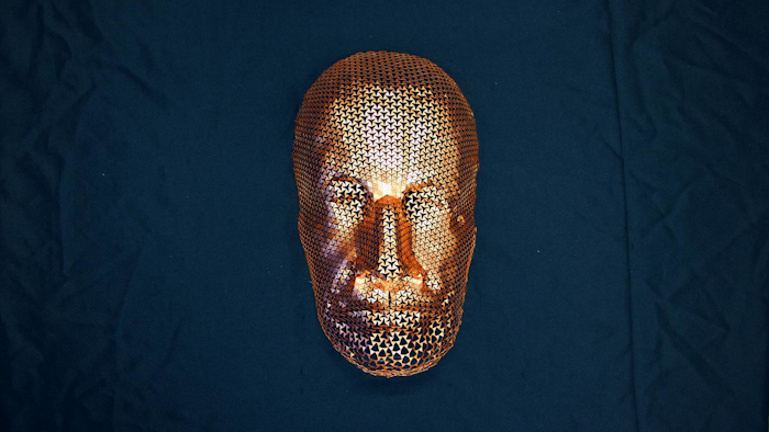 A computational design tool created a pattern of perforations that enabled a flat sheet of copper to form a 3D mask. This tool could be used to explore the possibilities of materials that stretch uniformly.