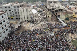 In this April 25, 2013, file photo, Bangladeshi people gather as rescuers look for survivors and victims at the site of a building that collapsed a day earlier, in Savar, near Dhaka, Bangladesh. A Bangladesh court on Monday, July 18, 2016, indicted 41 people for murder in the 2013 deaths of more than 1,100 people in the collapse of a building that housed five garment factories outside the capital.