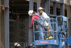 In this Thursday, May 19, 2016, photo, workers construct a building in Boston. On Friday, July 8, the U.S. government issues the June jobs report.