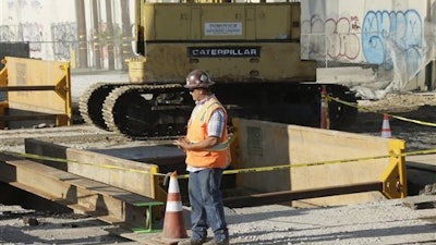 Work is underway Tuesday morning, July 19, 2016, to repair a sewage spill at Mission Road and 6th Street in downtown Los Angeles. Beaches in Long Beach have been shut down after a sewage spill that began near downtown Los Angeles the day before, flowed down the LA River to the ocean. Long Beach officials estimate that more than 100,000 gallons of sewage reached the city, and its ocean waters will be closed until testing shows it's safe.