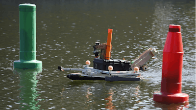 An autonomous surface vehicle from Georgia Institute of Technology, navigates an obstacle course during the 9th annual AUVSI Foundation and Office of Naval Research-sponsored International RoboBoat competition held in Virginia Beach, Virginia.