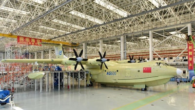 In this Saturday, July 23, 2016 photo released by Xinhua News Agency, the Amphibious aircraft AG600 rolls off a production line in Zhuhai, south China's Guangdong Province.