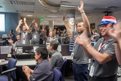 Engineers at Lockheed Martin celebrate after monitoring NASA’s Juno spacecraft as it goes into orbit at Jupiter.