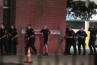Dallas police respond after shots were fired during a protest over recent fatal shootings by police in Louisiana and Minnesota, Thursday, July 7, 2016, in Dallas. Snipers opened fire on police officers during protests; several officers were killed, police said.