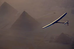 In this Wednesday, July 13, 2016, handout image provided by Solar Impulse, the Solar Impulse 2 flying over the pyramids, Egypt Cairo. The experimental solar-powered airplane has arrived in Egypt as part of its global voyage.