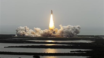 In this July 8, 2011 file photo, the space shuttle Atlantis lifts off from the Kennedy Space Center in Cape Canaveral, Fla. This is the 135th and final space shuttle launch for NASA.