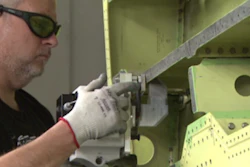 Lockheed Martin employee Spencer Beavers uses the first laser ablation system implemented into the F-35 wing structure production at Lockheed Martin’s factory in Fort Worth, Texas.