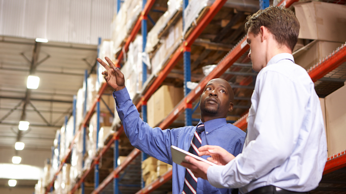 Two Businessmen With Digital Tablet In Warehouse 000024172650 Small 57a3568d753c9