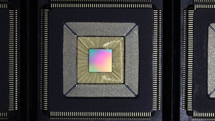 Unlidded Princeton Piton Processor is shown. Multicolored die is wirebonded inside chip package.