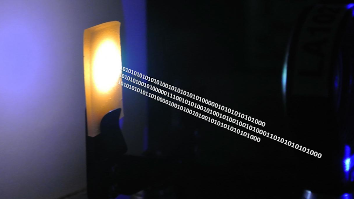 A nanocrystal-based material converts blue laser emission to white light for combined illumination and data communication.