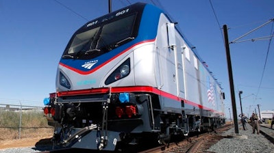 In this May 13, 2013, file photo one of the new Amtrak Cities Sprinter Locomotive makes a demonstration run during unveiling ceremonies at the Siemens Rails Systems factory in Sacramento, Calif.