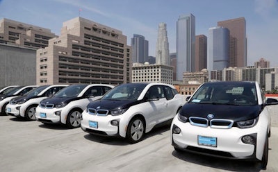 This June 8, 2016 file photo shows electric cars parked atop the Los Angeles Police Department parking lot, in Los Angeles. A California lawmaker told The Associated Press on Friday, Aug. 12, that she's introducing legislation to require that 15 percent of new vehicles be emission-free in less than a decade, a significant escalation in the state's efforts to speed the evolution of new car technology.
