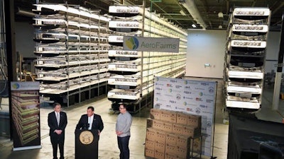 In this Thursday, March 24, 2016, file photograph, New Jersey Gov. Chris Christie, center at podium, addresses a gathering at AeroFarms, a vertical farming operation in Newark, N.J. AeroFarms is now refurbishing an old steel mill in New Jersey and they say it will soon be the site of the world's largest indoor vertical farm. The company says their Newark facility, set to open in September, could produce 2 million pounds of food per year and help with farming land loss and long-term food shortages.