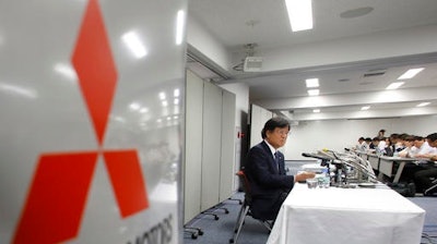 In this Aug. 2, 2016 file photo, Mitsubishi Motors Corp. Chairman Osamu Masuko attends a press conference at the headquarters of the automaker in Tokyo.