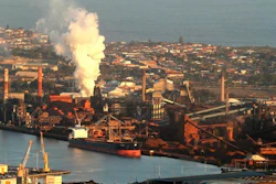 In this July 2, 2014 file photo, smoke billows out of a chimney stack of BHP steelwork factories at Port Kembla, south of Sydney, Australia. The world's biggest miner, BHP Billiton, on Tuesday, Aug. 16, 2016, reported a $6.4 billion loss, the worst full-year result in the Anglo-Australian company's history. BHP said the result for the fiscal year ending June 30 came from a 31 percent fall in revenue to $30.1 billion amid weak commodity prices, write downs of U.S. oil and gas assets and a disaster at a Brazilian mining joint venture.