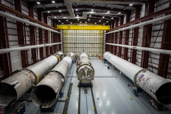 This June 6, 2016 photo made available by SpaceX shows recovered Falcon rocket boosters in a hangar at the Kennedy Space Center on Merritt Island, Fla. The company says it can save considerable time and money by reusing the big, expensive parts.