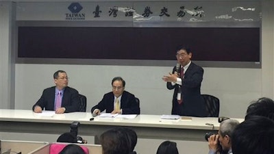 Foxconn, or also known as Hon Hai Precision Industry, spokesman Simon Hsing, right, announces the purchase of a controlling stake in Japan's Sharp Corp. during a press conference at the Taiwan Stock Exchange Corp. in Taipei, Taiwan, Wednesday, March 30, 2016.