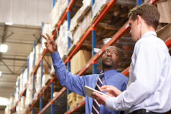 Two Businessmen With Digital Tablet In Warehouse 000024172650 Small 57a3568d753c9