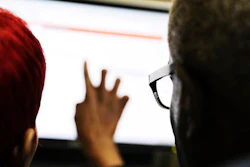 In this Thursday, March 3, 2016, file photo, Georgia Department of Labor services specialist Louis Holliday, right, helps a woman with a job search on a computer at an unemployment office in Atlanta. On Thursday, Aug. 11, the Labor Department reports on the number of people who applied for unemployment benefits in the previous week.