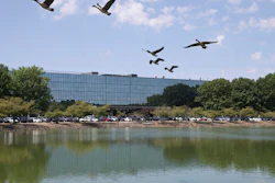 In this Wednesday, July 20, 2016 photo, the long vacant, former Bell Labs building is seen in Holmdel, N.J. The 2 million-square-foot building where Bell Labs scientists helped launch modern cellular networks before it became one of the country's largest vacant office buildings is drawing companies with the lure of working at a complex surrounded by technological history.
