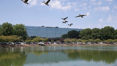 In this Wednesday, July 20, 2016 photo, the long vacant, former Bell Labs building is seen in Holmdel, N.J. The 2 million-square-foot building where Bell Labs scientists helped launch modern cellular networks before it became one of the country's largest vacant office buildings is drawing companies with the lure of working at a complex surrounded by technological history.
