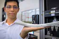 This is NTU Asst Prof Yang En-Hua, holding the bendable concrete which his team had invented.