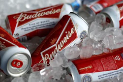 In this Thursday, March 5, 2015, file photo, Budweiser beer cans are seen at a concession stand at McKechnie Field in Bradenton, Fla. A British court has ruled that two groups of SABMiller shareholders should vote separately on Anheuser-Busch InBev’s 79 billion pound ($104 million) takeover, effectively giving smaller investors the outside chance to derail the deal. he decision Tuesday, AUG. 23, 2016 is seen as a concession to smaller shareholders who complained that their payout plummeted in relation to larger investors after the pound fell following Britain’s vote to leave the European Union.