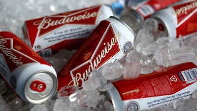 In this Thursday, March 5, 2015, file photo, Budweiser beer cans are seen at a concession stand at McKechnie Field in Bradenton, Fla. A British court has ruled that two groups of SABMiller shareholders should vote separately on Anheuser-Busch InBev’s 79 billion pound ($104 million) takeover, effectively giving smaller investors the outside chance to derail the deal. he decision Tuesday, AUG. 23, 2016 is seen as a concession to smaller shareholders who complained that their payout plummeted in relation to larger investors after the pound fell following Britain’s vote to leave the European Union.