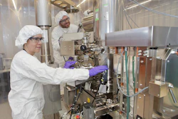 Brookhaven National Laboratory Center for Functional Nanomaterials researchers Gwen Wright and Aaron Stein are at the electron beam lithography writer in the CFN cleanroom.