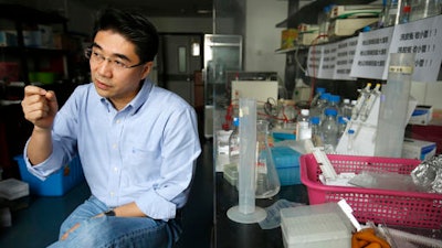 In this April 13, 2016 photo, Li Chenjian, a vice provost at Peking University, speaks during an interview at the school's campus in Beijing. China is recruiting thousands of high-achieving overseas Chinese to come home through the 1,000 Talents program, one of many state efforts launched in recent years to reverse a decades-long brain drain.