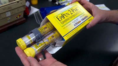 In this July 8, 2016 file photo, a package of EpiPens, an epinephrine autoinjector for the treatment of allergic reactions is displayed in Sacramento, Calif. Lawmakers are demanding more information on why the price for live-saving EpiPens has skyrocketed. EpiPens are used largely by children to ward off potentially fatal allergic reactions, and its price has surged in recent years. A two-dose package cost less than $60 nine years ago. The cost is now closer to $400.
