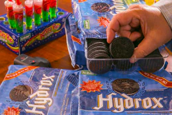 In this Wednesday, Aug. 2, 2016 photo, Ellia Kassoff, CEO of Leaf Brands, a Newport Beach candy and cookie company, poses with Hydrox cookies at the offices of his distributor in Pico Rivera, Calif. Kassoff is concerned about how the public will react to labels that say its food has GMOs _ although the bulk of the nation’s corn and soybean crops are now genetically modified.