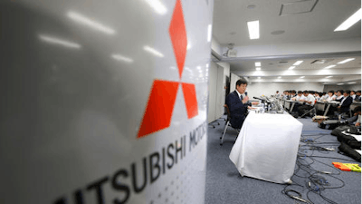 Mitsubishi Motors Corp. Chairman Osamu Masuko speaks during a press conference at the headquarters of the Mitsubishi Motors Corp. in Tokyo, Tuesday, Aug. 2, 2016. A group of lawyers asked by Mitsubishi Motors to investigate mileage cheating at the Japanese automaker found a divided company that had set unrealistic goals, to which employees simply couldn't say, 'No.' Masuko reiterated an apology and promised the company will penalize managers found responsible for the cheating.